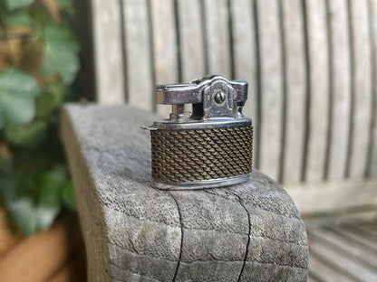 Small petrol lighter called Happy with a chain mail design body 2.5cm wide