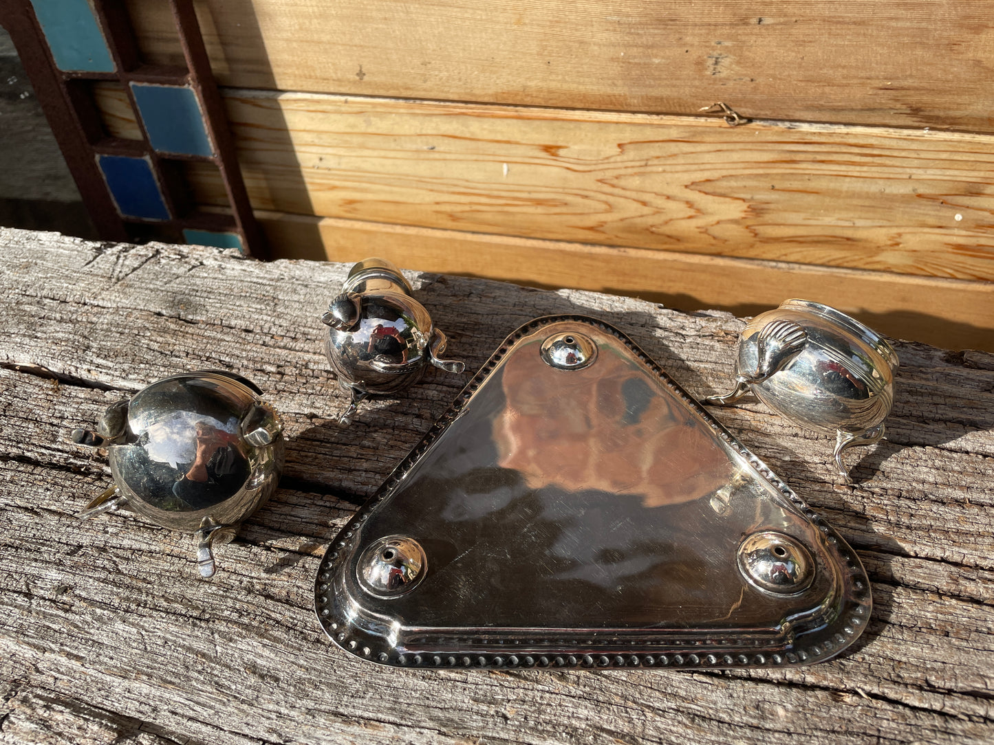 Silver plated cruet set with cobalt blue glass liners and triangular tray