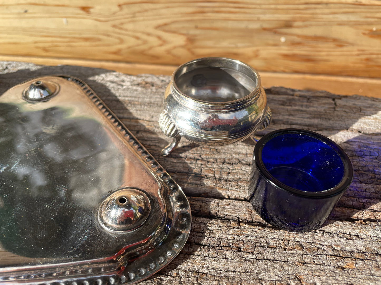 Silver plated cruet set with cobalt blue glass liners and triangular tray