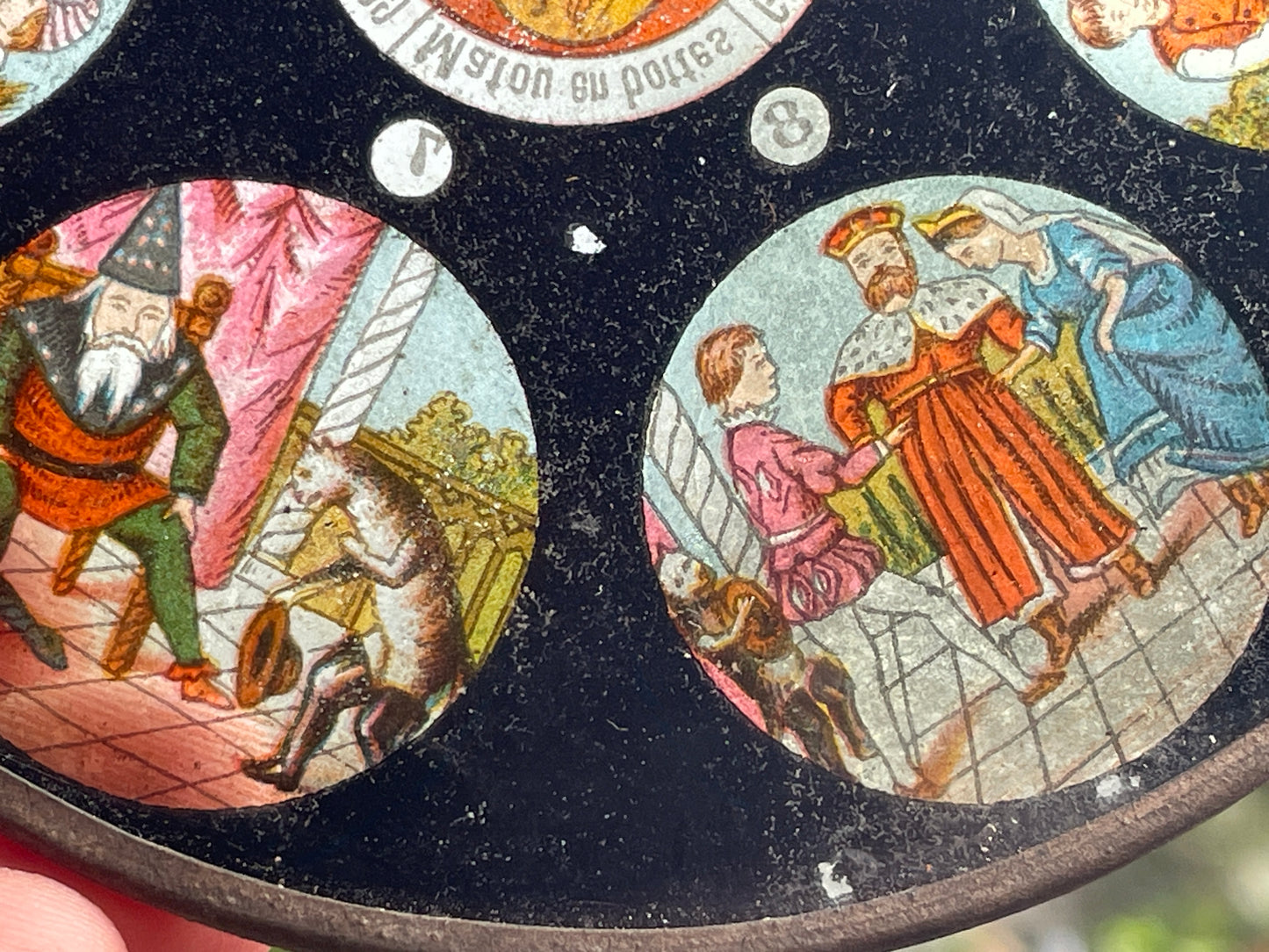 Two Victorian glass disc magic lantern colour slides