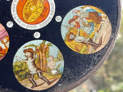 Two Victorian glass disc magic lantern colour slides