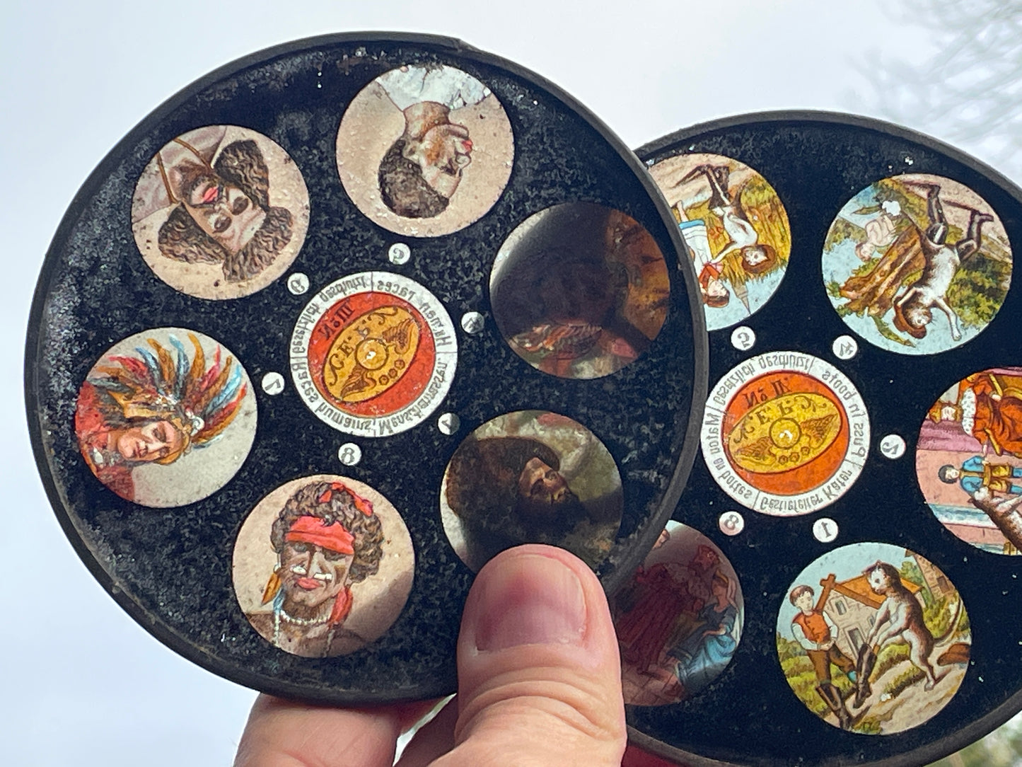 Two Victorian glass disc magic lantern colour slides