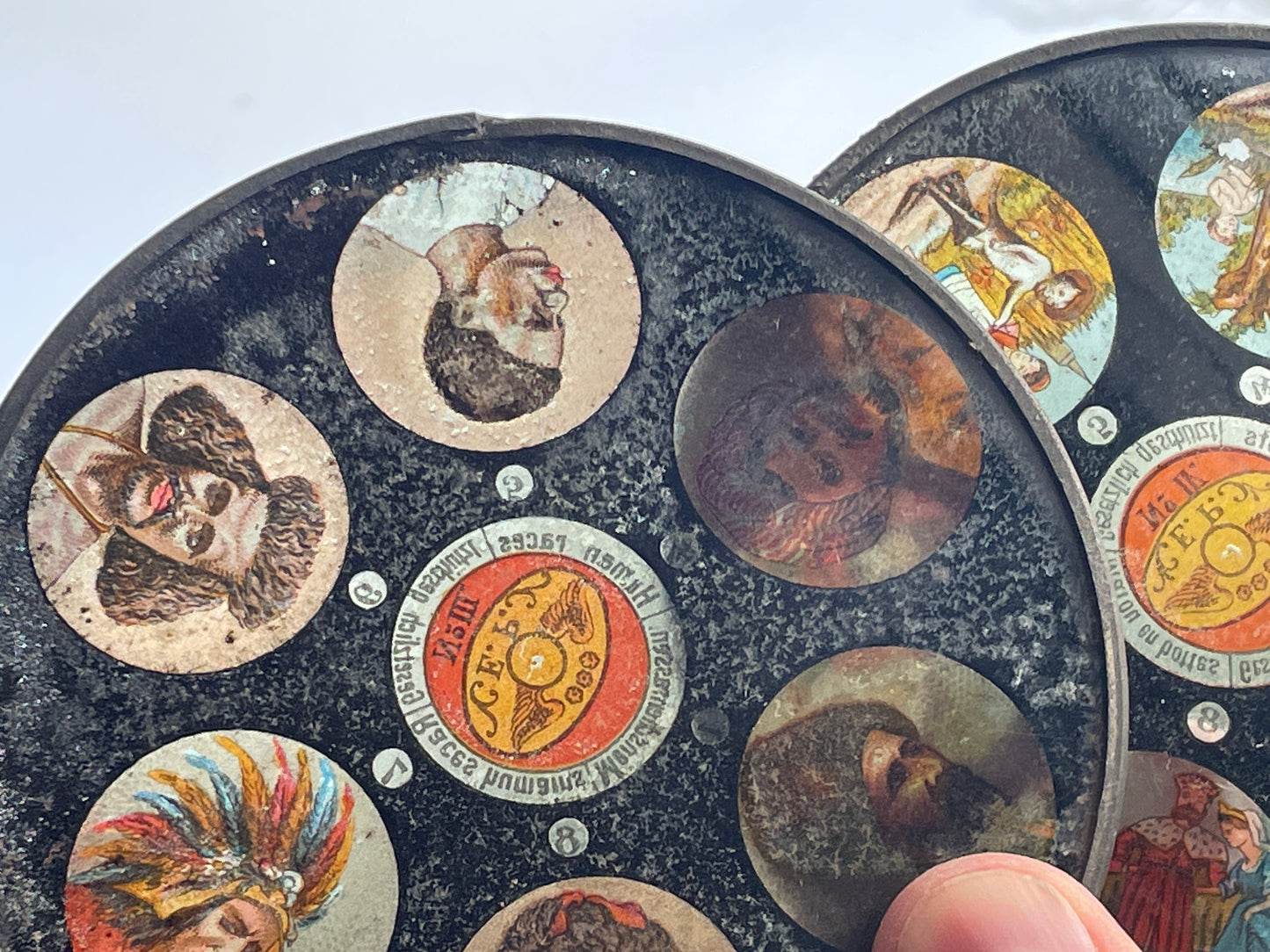 Two Victorian glass disc magic lantern colour slides