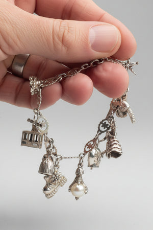 Charm bracelet some marked 800 silver 26g