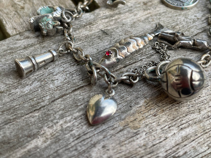 Childs Charm bracelet some marked silver 31g