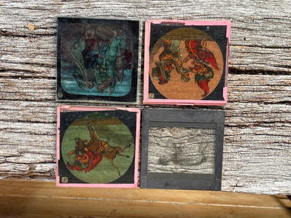 Four Victorian glass disc magic lantern colour slides