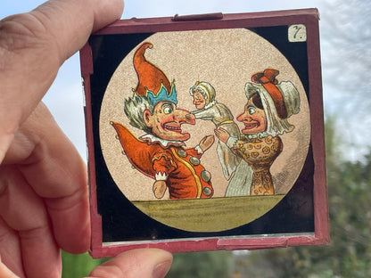 Four Victorian glass disc magic lantern colour slides