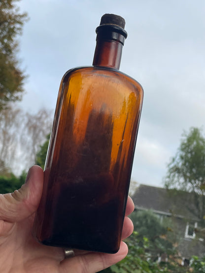 Antique brown glass with original cork GB 10 oz to base c1890