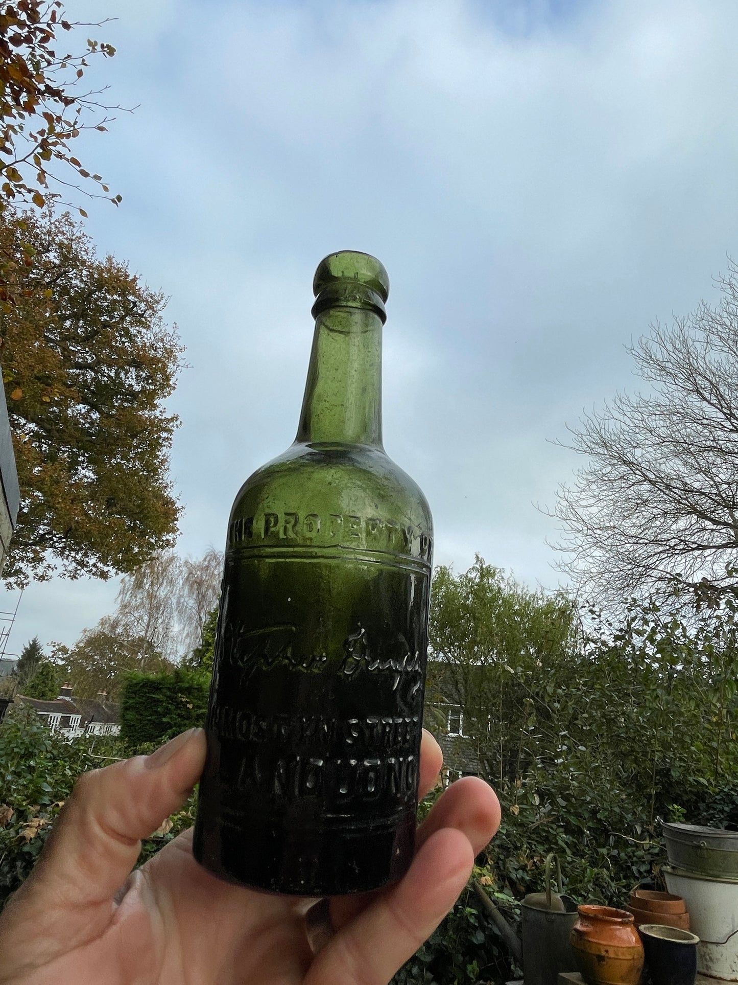 Antique green glass bottle Stephen Dunphy 111 Mostyn Street Llandudno North Wales c1900