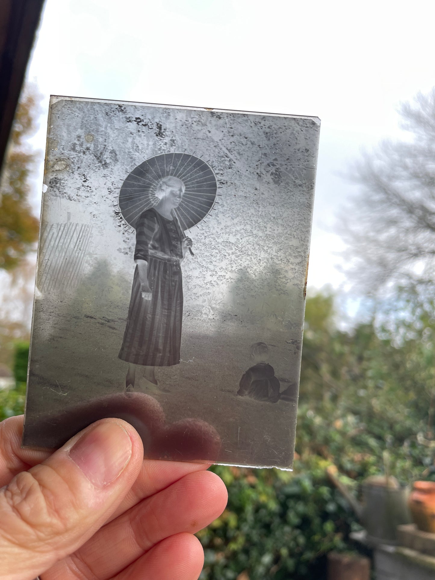 A collection of fifteen photographic glass plates c 1920 some risqué