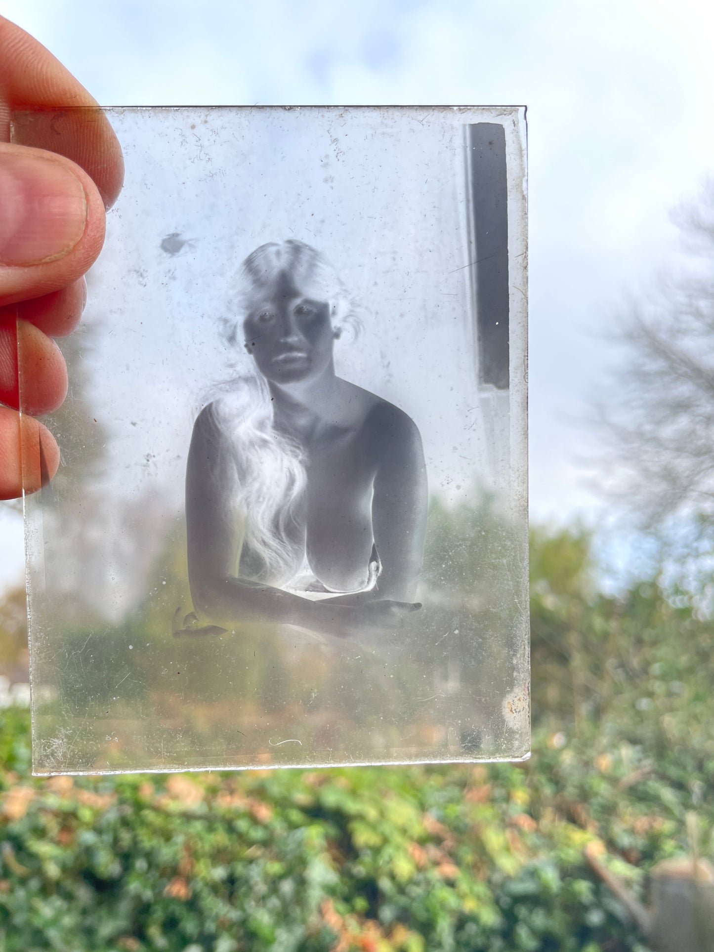 A collection of fifteen photographic glass plates c 1920 some risqué