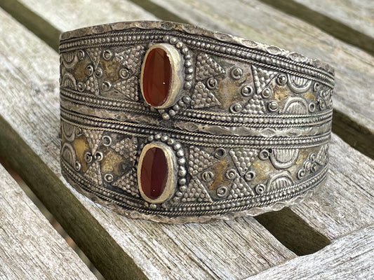 Vintage Kazakh white metal cuff bracelet with two orangey red agate stones