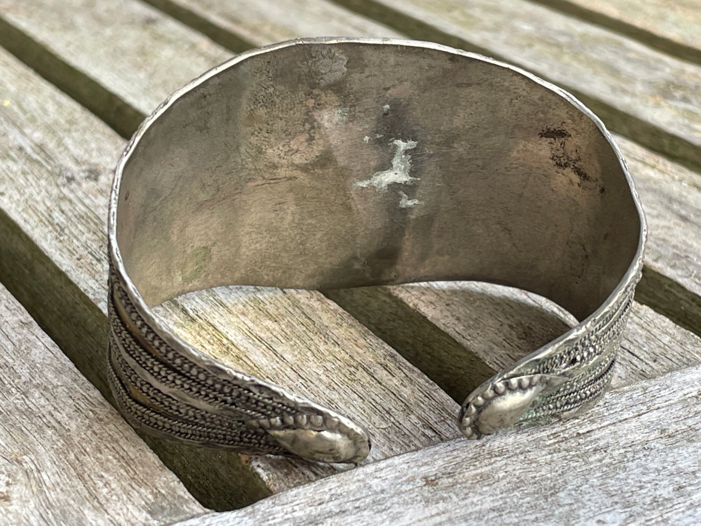 Vintage Kazakh white metal cuff bracelet with two orangey red agate stones