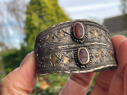 Vintage Kazakh white metal cuff bracelet with two orangey red agate stones