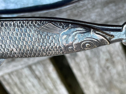 Pair of antique sardine tongs or servers in the shape of a sardine fish 11cm long