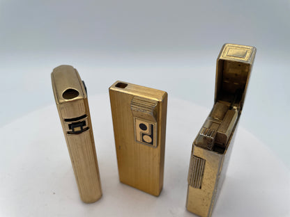 Vintage Trio of Collectible Pocket Lighters: Ronson Varaflame, Win 3000, and M-2500 Piezo Electric – Mid-to-Late 20th Century