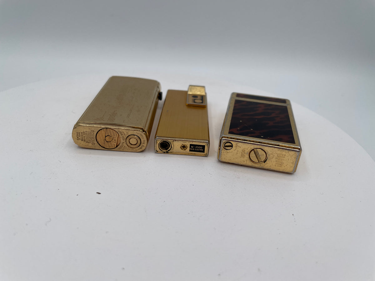 Vintage Trio of Collectible Pocket Lighters: Ronson Varaflame, Win 3000, and M-2500 Piezo Electric – Mid-to-Late 20th Century