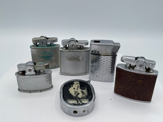 Vintage Sextet of Collectible Pocket Lighters: Ronson, Sim, and Marilyn Monroe Champ – Mid-20th Century & Modern