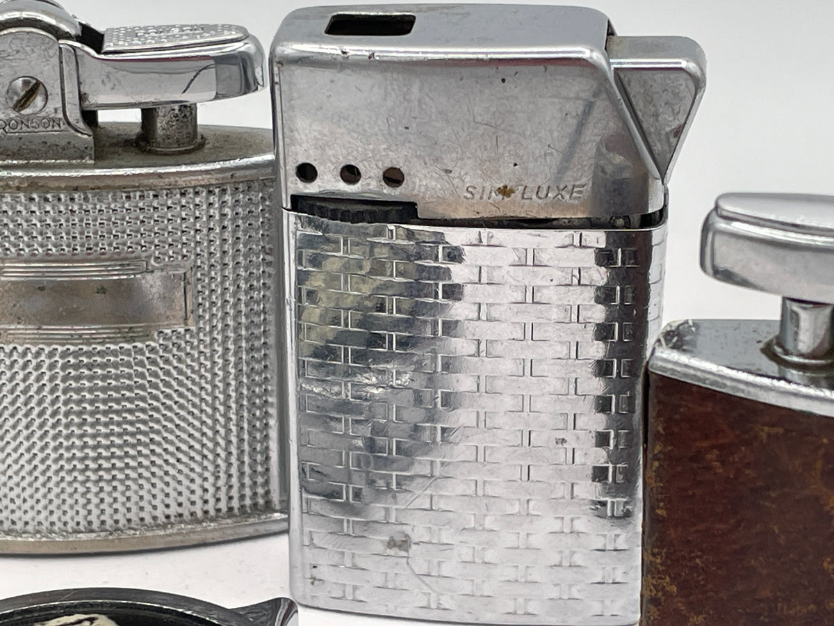 Vintage Sextet of Collectible Pocket Lighters: Ronson, Sim, and Marilyn Monroe Champ – Mid-20th Century & Modern