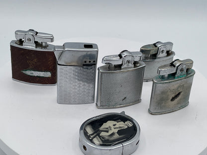 Vintage Sextet of Collectible Pocket Lighters: Ronson, Sim, and Marilyn Monroe Champ – Mid-20th Century & Modern