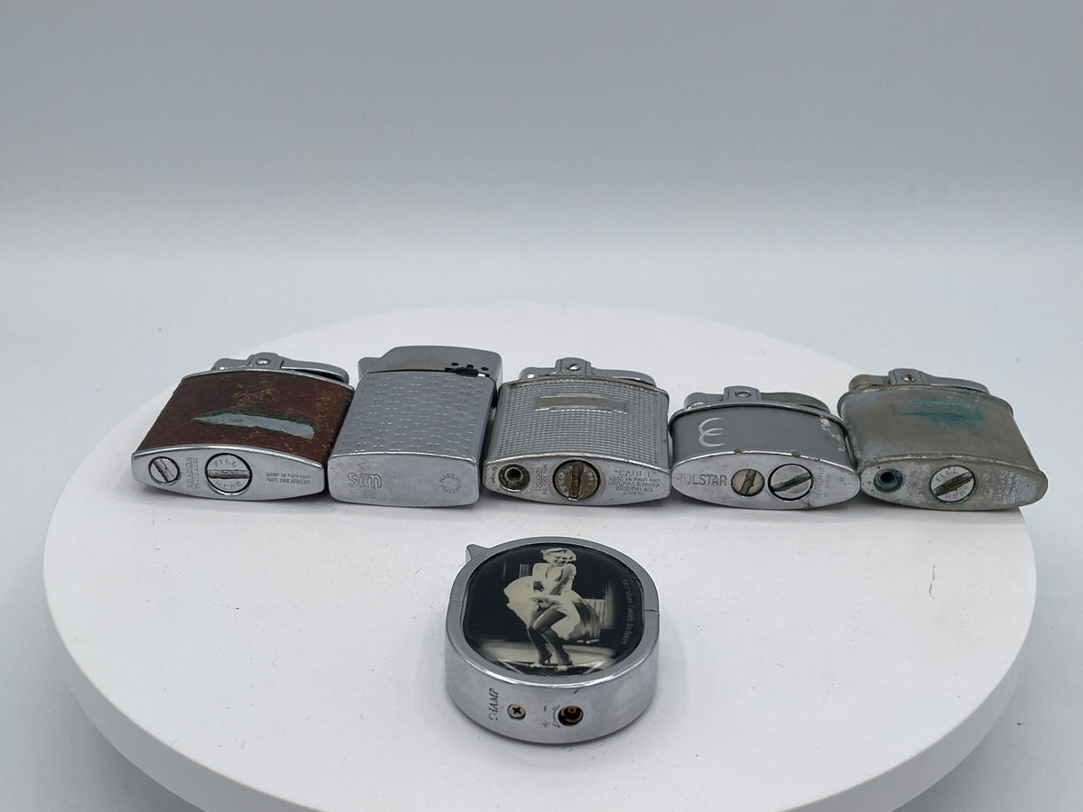 Vintage Sextet of Collectible Pocket Lighters: Ronson, Sim, and Marilyn Monroe Champ – Mid-20th Century & Modern