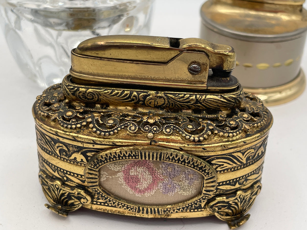Vintage Trio of Table Lighters: Rolstar Brass, Crystal Cut Glass, and Ornate Petit Point Tapestry – Mid-20th Century
