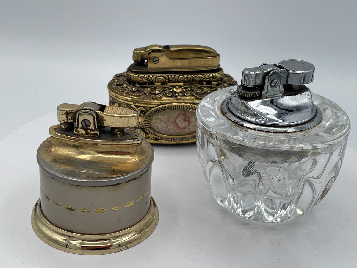 Vintage Trio of Table Lighters: Rolstar Brass, Crystal Cut Glass, and Ornate Petit Point Tapestry – Mid-20th Century