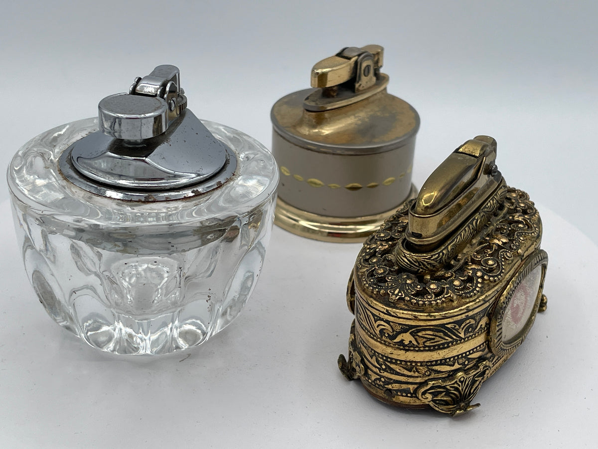 Vintage Trio of Table Lighters: Rolstar Brass, Crystal Cut Glass, and Ornate Petit Point Tapestry – Mid-20th Century