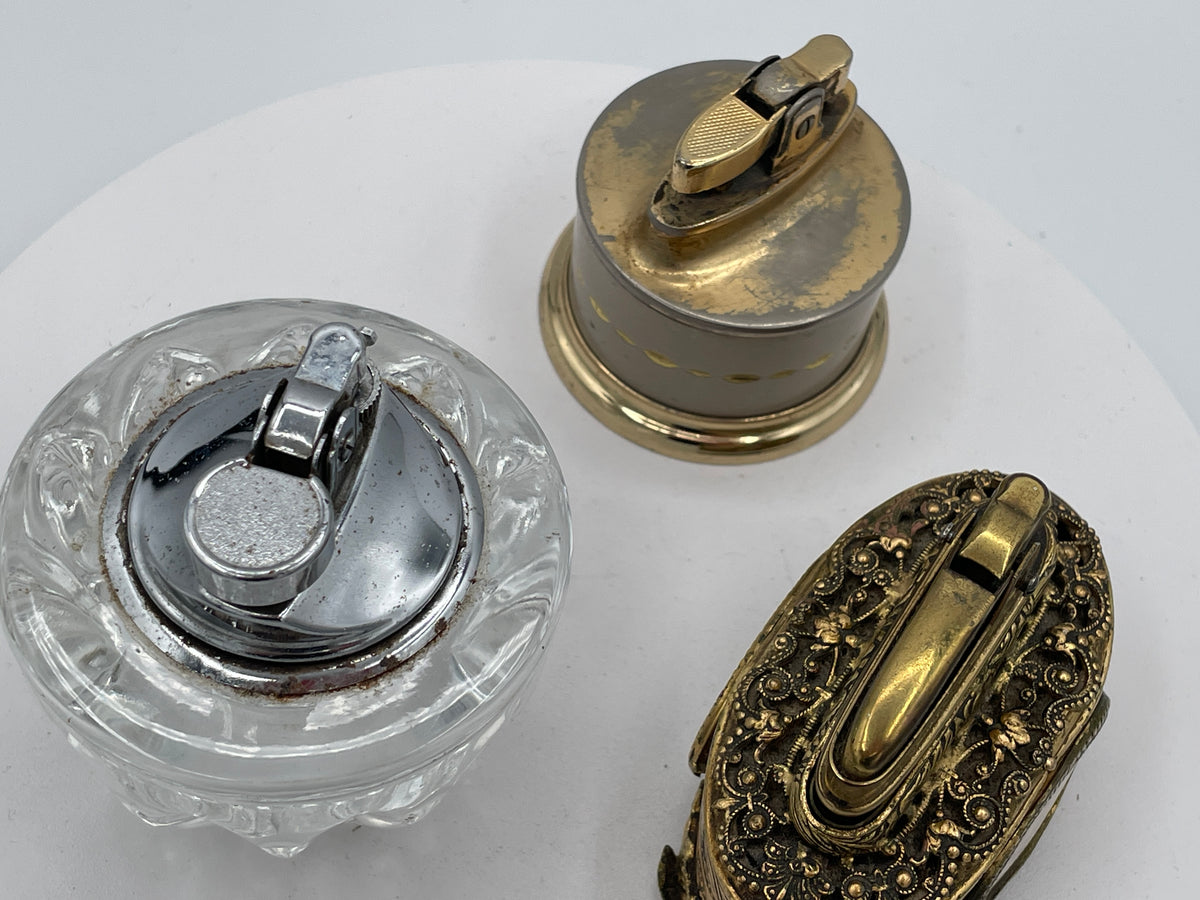 Vintage Trio of Table Lighters: Rolstar Brass, Crystal Cut Glass, and Ornate Petit Point Tapestry – Mid-20th Century