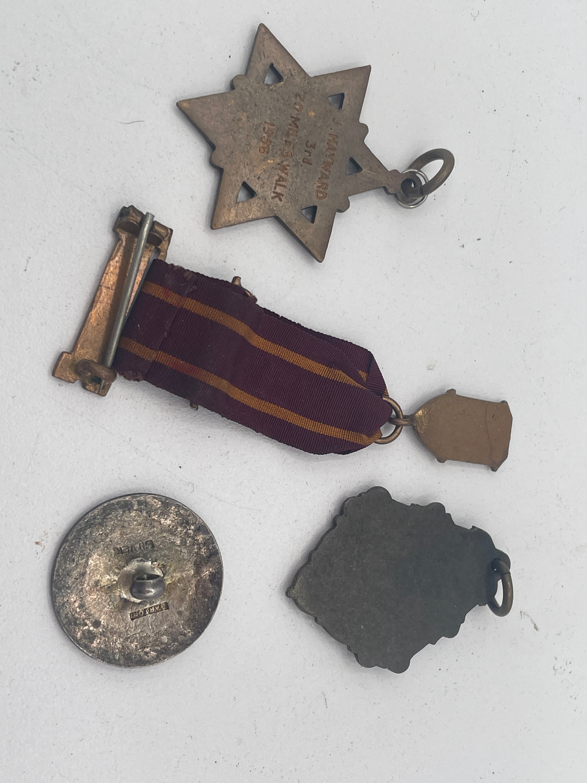 Vintage British & Colonial Collectible Lot: Presidency Golf Club Bombay Silver Button, 1956 Enfield Walking Medal, League of Light Ribbon & National Gymnastic Display Pendant