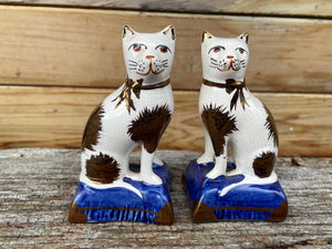 Staffordshire ceramic cats - male and female cat figurines c1910