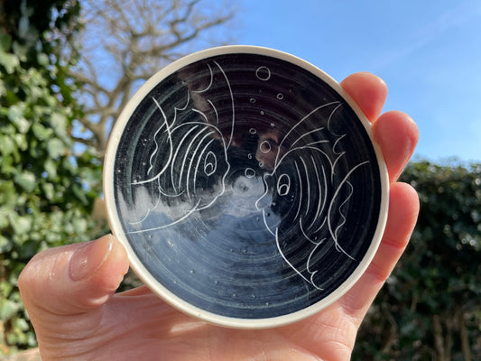 Jersey Pottery shallow dish with Sgraffito fish design in black and white 10.5cm diameter c1965