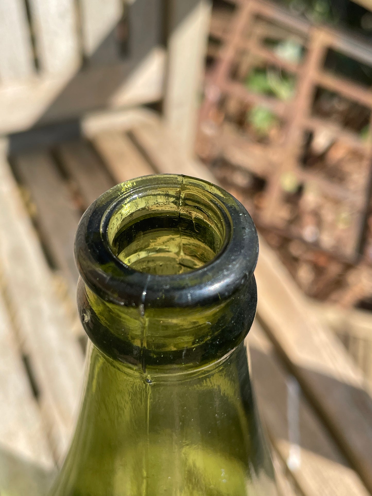 Four antique and vintage green glass bottles