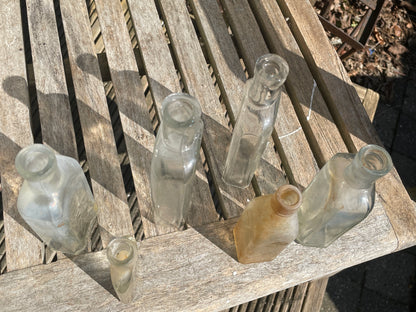 six antique and vintage clear glass bottles tallest  - Sloan's Liniment example 15cm