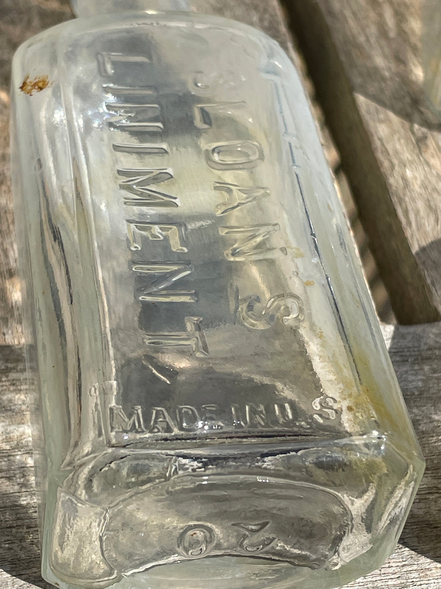 six antique and vintage clear glass bottles tallest  - Sloan's Liniment example 15cm
