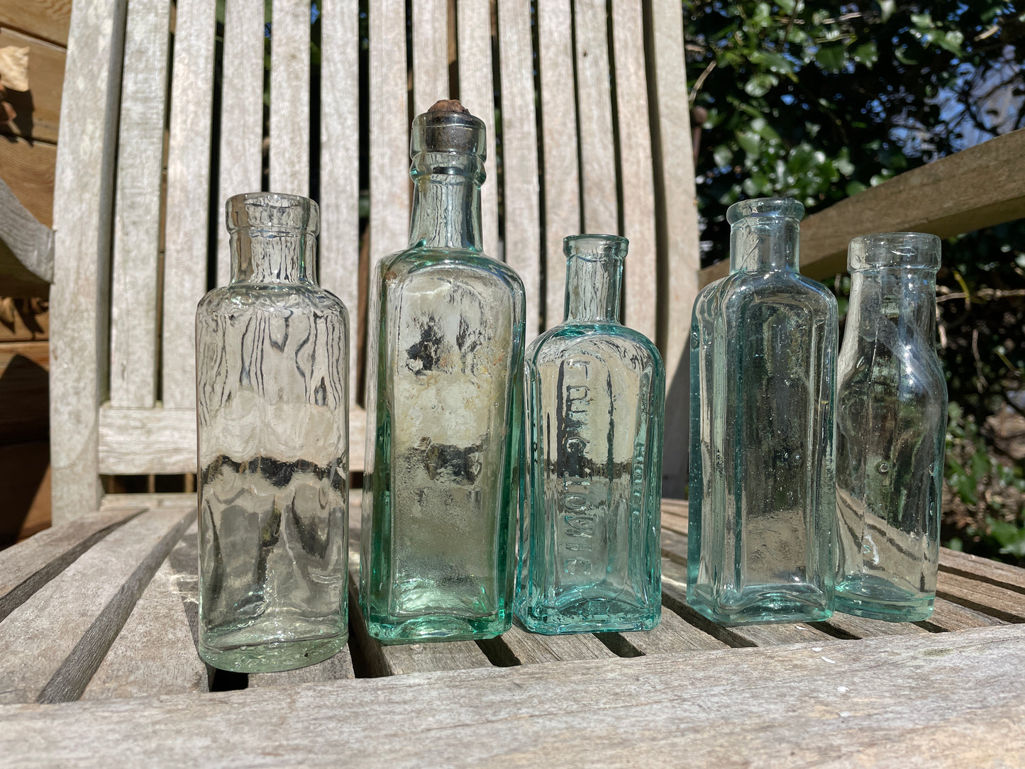 Five Antique and vintage small bottles incl. Masons Extract and Owbridge's Lung Tonic Hull examples