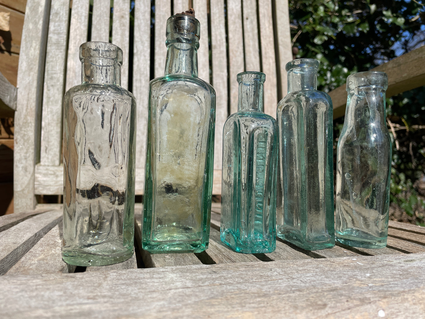 Five Antique and vintage small bottles incl. Masons Extract and Owbridge's Lung Tonic Hull examples