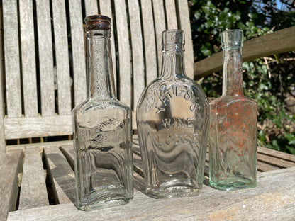 Yates's Wine Lodge  and two other long necked antique bottles