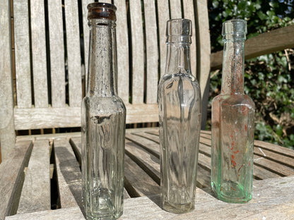 Yates's Wine Lodge  and two other long necked antique bottles