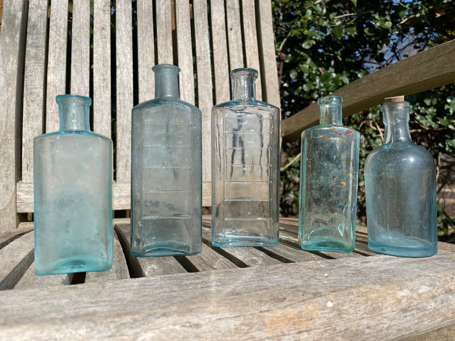 five Victorian pale blue antique Victorian bottles - Two ribbed examples tallest 16.5cm