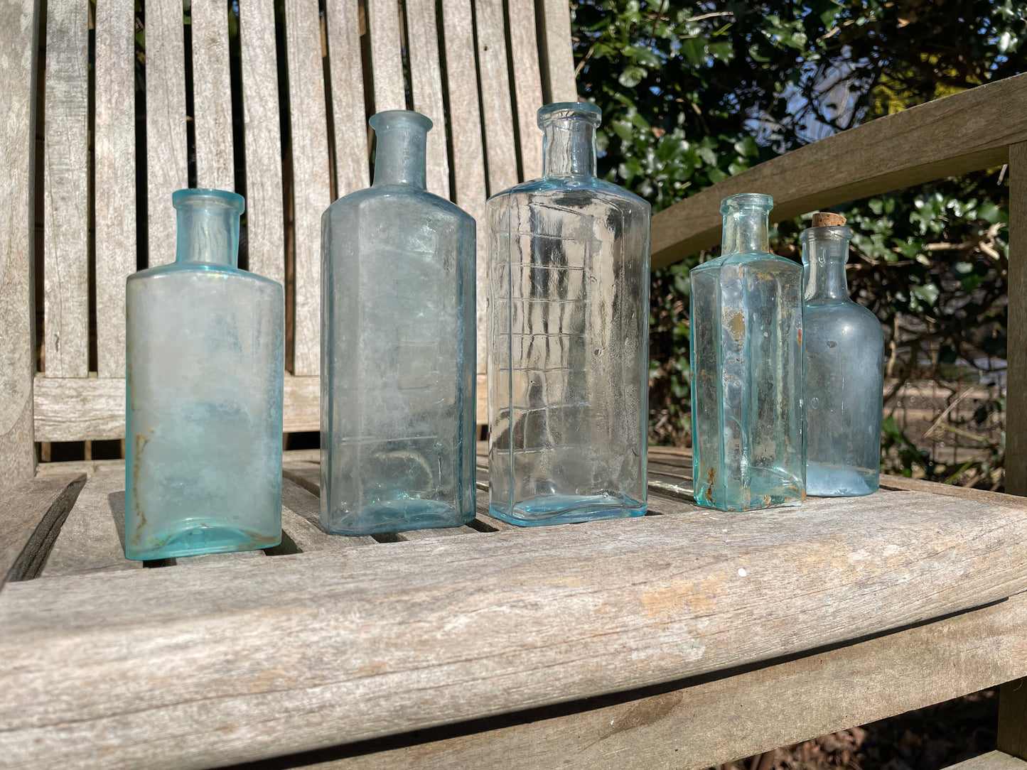 five Victorian pale blue antique Victorian bottles - Two ribbed examples tallest 16.5cm