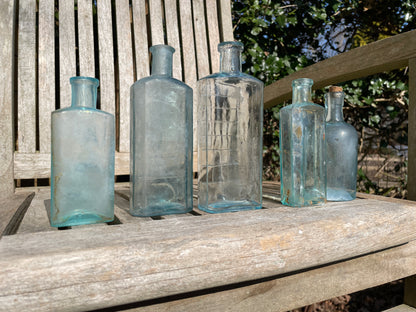 five Victorian pale blue antique Victorian bottles - Two ribbed examples tallest 16.5cm