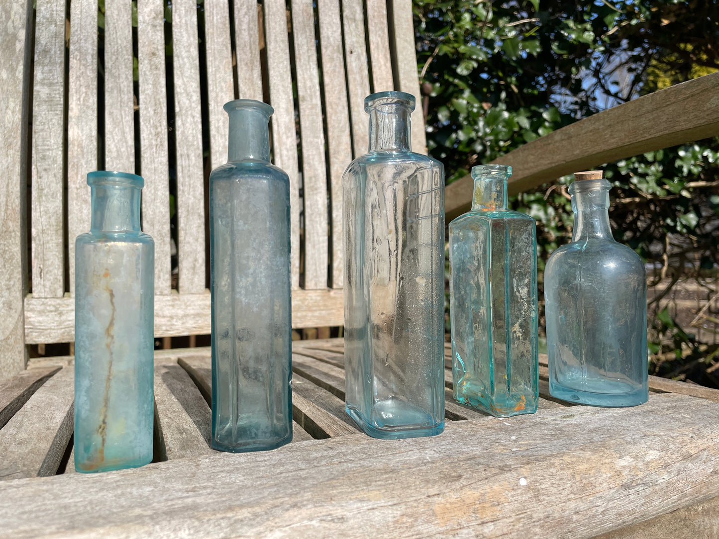 five Victorian pale blue antique Victorian bottles - Two ribbed examples tallest 16.5cm