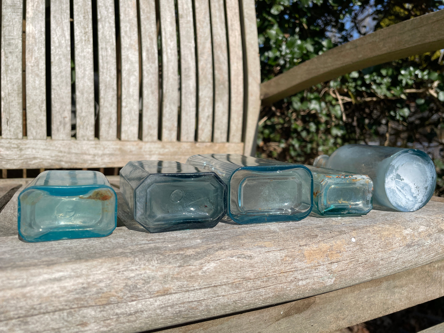 five Victorian pale blue antique Victorian bottles - Two ribbed examples tallest 16.5cm