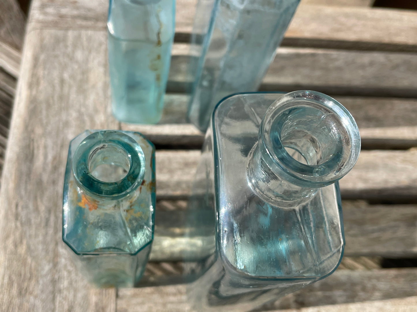 five Victorian pale blue antique Victorian bottles - Two ribbed examples tallest 16.5cm