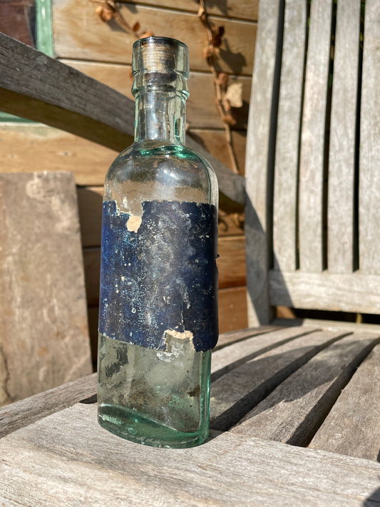 Victorian bottle with original label and cork embossed S&R to base