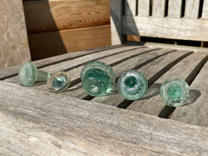 Five glass bottle stoppers one marked Prepared by Eno's Patent c1890's