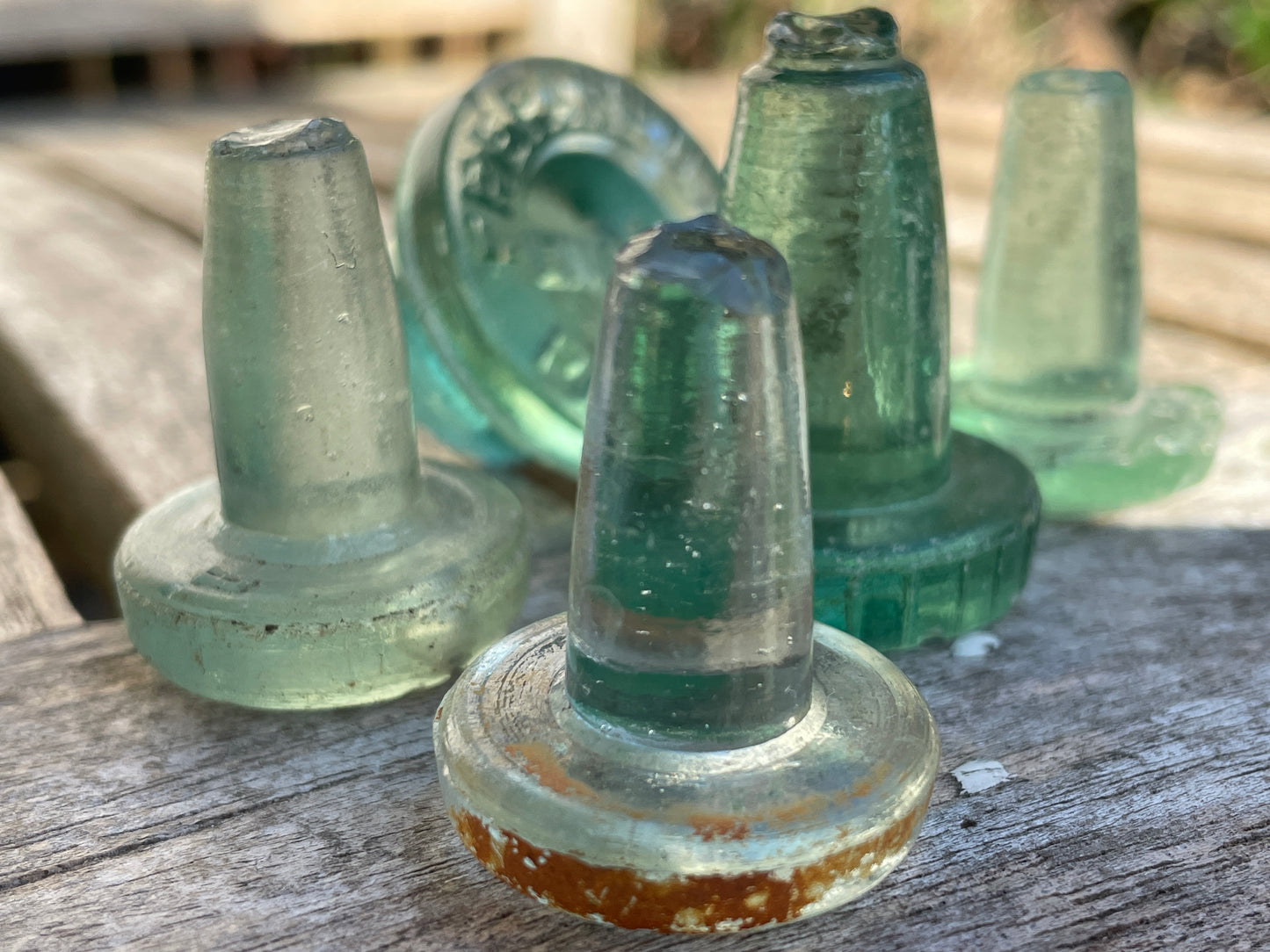 Five glass bottle stoppers one marked Prepared by Eno's Patent c1890's
