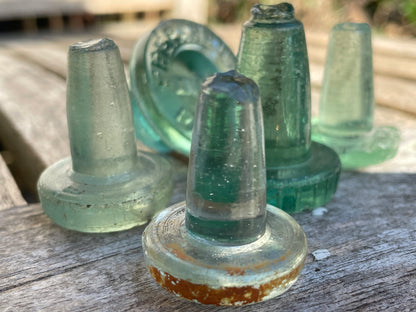 Five glass bottle stoppers one marked Prepared by Eno's Patent c1890's