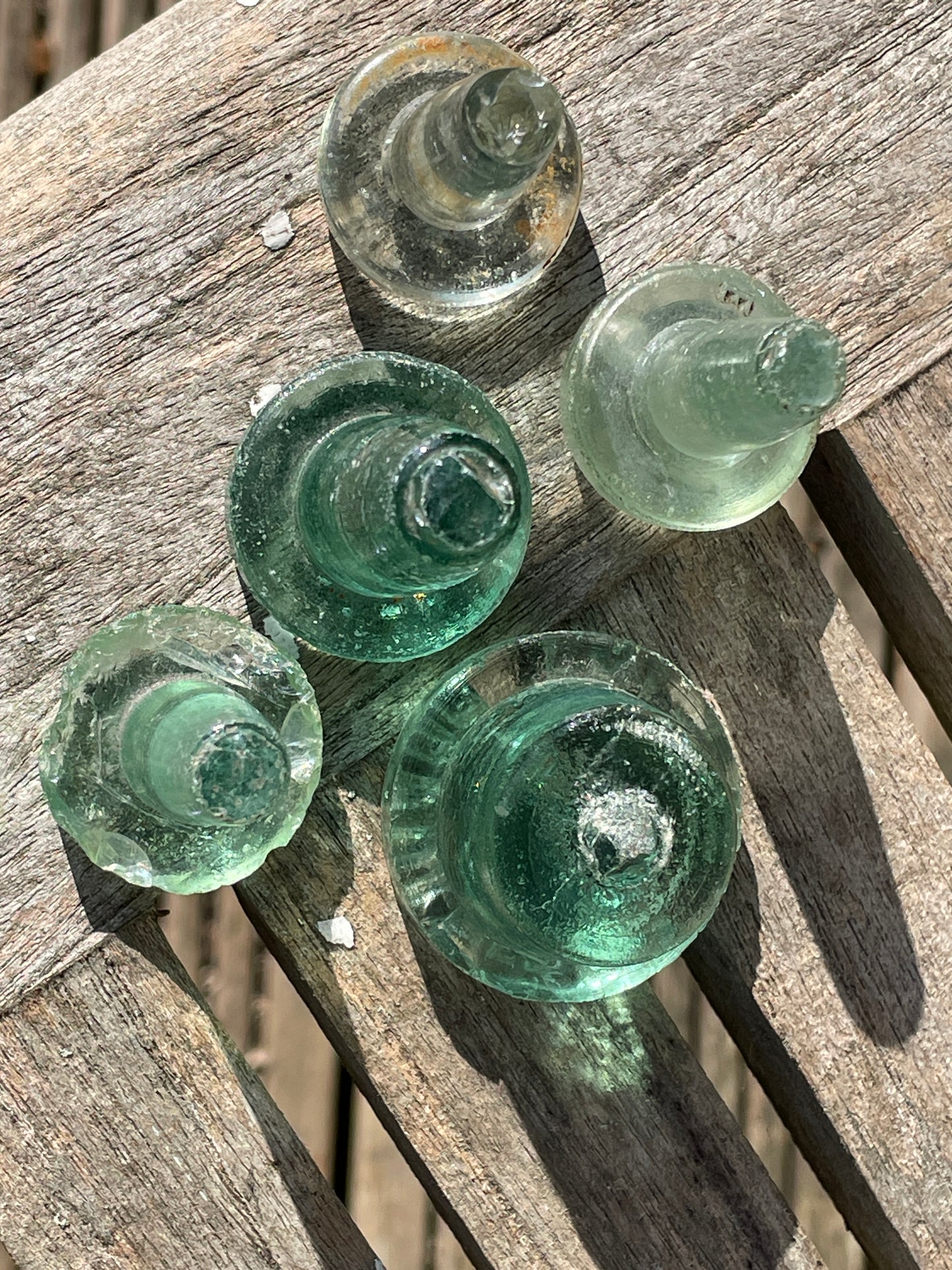 Five glass bottle stoppers one marked Prepared by Eno's Patent c1890's